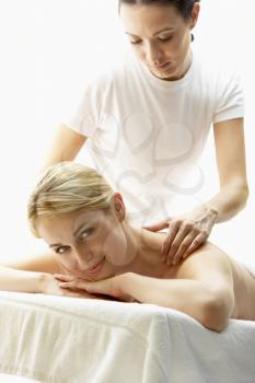 Royalty Free Photo of a Young Woman Getting a Massage