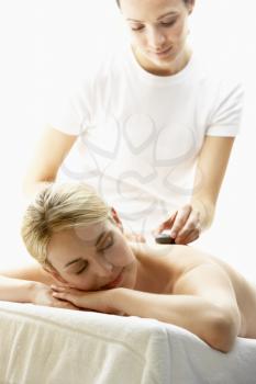 Royalty Free Photo of a Woman Getting a Hot Stone Massage