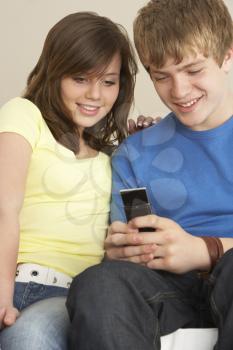 Royalty Free Photo of a Couple Reading a Text Message
