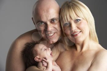 Royalty Free Photo of a Mother, Father, and Baby