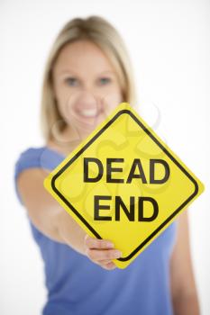 Royalty Free Photo of a Woman Holding a Dead End Sign