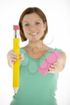 Royalty Free Photo of a Woman With a Big Pencil and Eraser