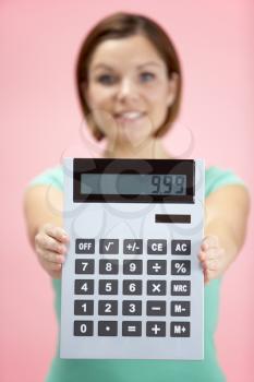 Royalty Free Photo of a Woman Holding a Calculator