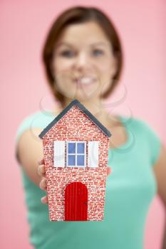 Royalty Free Photo of a Woman Holding a Model House