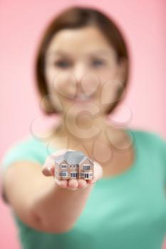 Royalty Free Photo of a Woman Holding a Small House