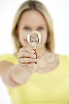 Royalty Free Photo of a Woman With a Magnifying Glass