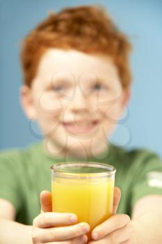 Royalty Free Photo of a Boy With a Glass of Juice