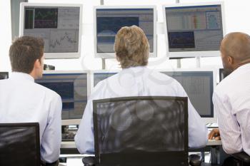 Royalty Free Photo of Stock Traders Viewing Monitors