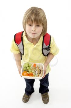Royalty Free Photo of a Little Boy With a Lunchbox