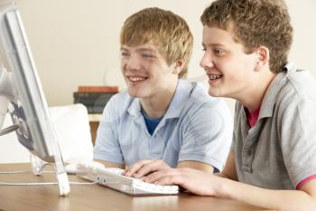 Royalty Free Photo of Two Boys on a Computer