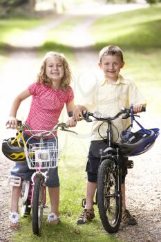 Royalty Free Photo of Two Children With Bikes