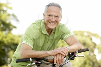 Royalty Free Photo of a Man With a Bike