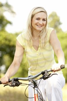Royalty Free Photo of a Young Woman on a Bike