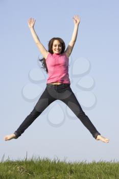 Royalty Free Photo of a Jumping Girl Outside