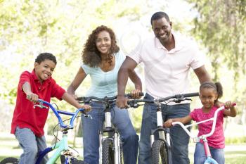 Royalty Free Photo of a Family Riding Bikes