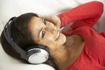 Royalty Free Photo of a Young Woman Listening to Music