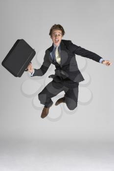 Businessman Jumping In Air