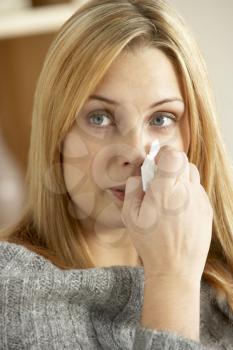 Young Woman With Cold Blowing Nose