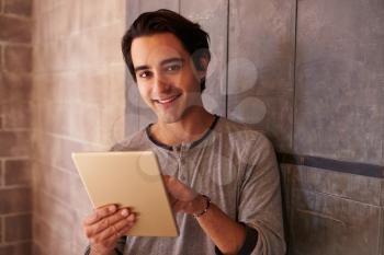 Male Designer In Modern Office Working On Digital Tablet