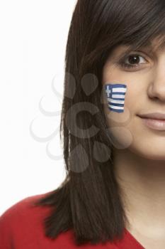 Young Female Sports Fan With Greek Flag Painted On Face