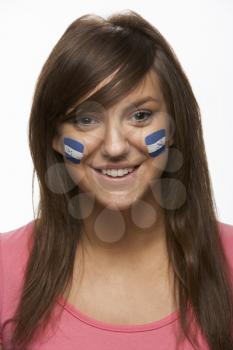 Young Female Sports Fan With Honduran Flag Painted On Face