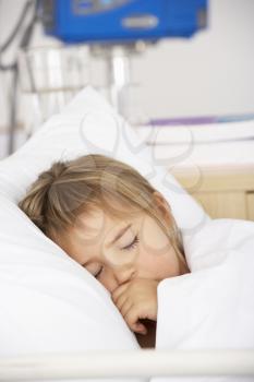Young girl asleep in Accident and Emergency bed