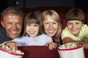 Family Watching Film In Cinema