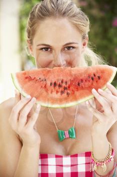 Woman Enjoying Slice Of Water Melon