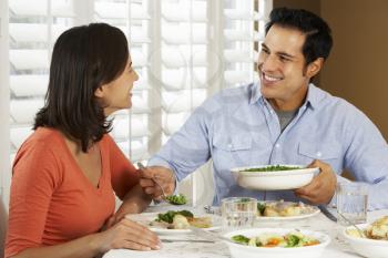 Couple Enjoying Meal At Home