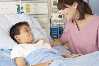 Nurse Visiting Child Patient On Ward