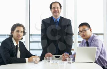 Group Of Businessmen Meeting In Office