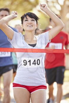 Female Runner Winning Marathon