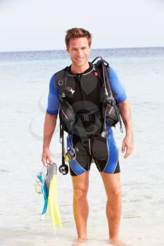Man With Scuba Diving Equipment Enjoying Beach Holiday