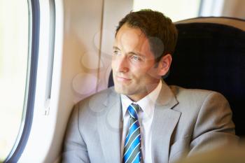 Businessman Relaxing On Train Journey