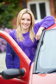 Teenage Girl Standing Next To Car Holding Key