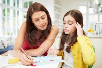 Mother Helping Daughter Struggling With Homework