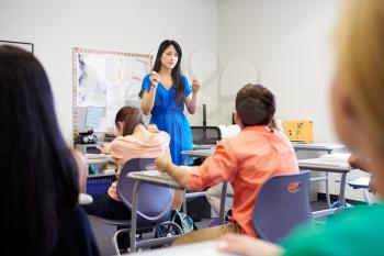 Female High School Teacher Taking Class