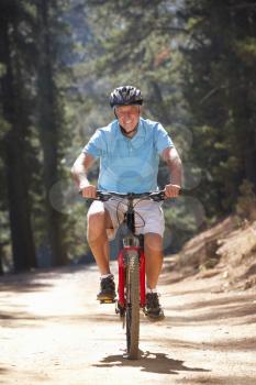 Senior man on country bike ride