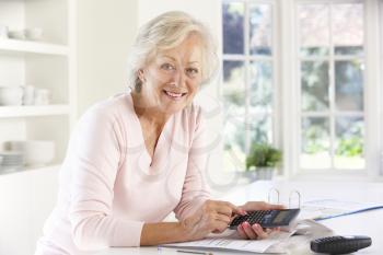 Retired woman with household bills