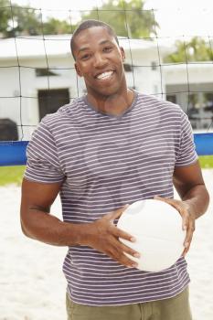 Portrait Of Man In Garden With Volleyball