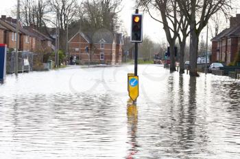 Flooded Urban Road With Traffic Lights
