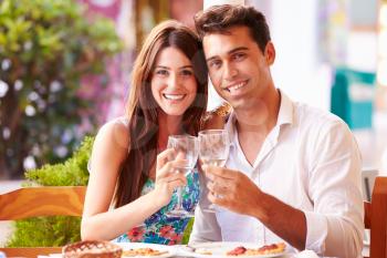 Young Couple Eating Meal Outdoors Together