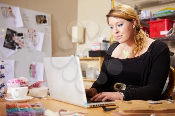 Jeweler Checking Orders For Business On Laptop