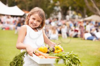 Girl With Fresh Produce Bought At Outdoor Farmers Market