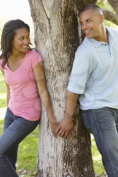 Portrait Of Romantic Young African American Couple In Park