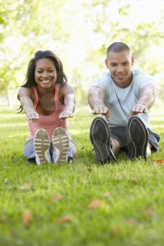 Young African American Couple Exercising In Park