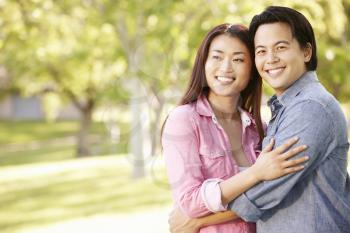 Romantic portrait Asian couple in park