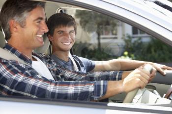 Father On Car Journey With Teenage Son