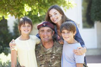 Portrait Of Soldier Returning Home With Family