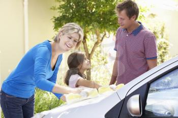 Family Washing Car Together